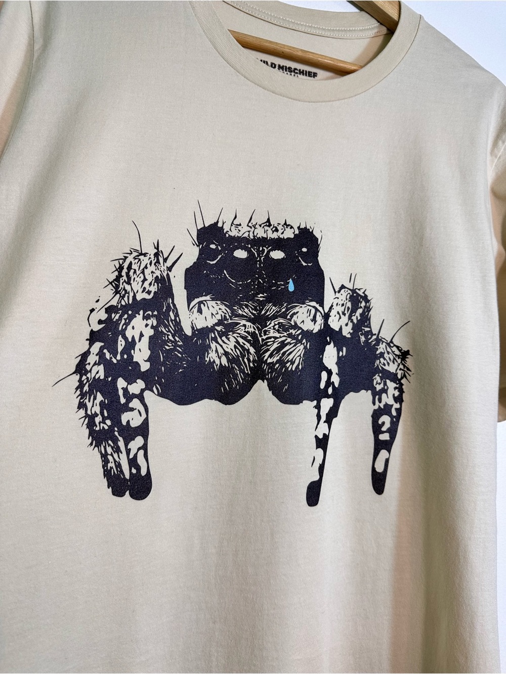 Cream Short-Sleeve Tee with Black Spider Graphic
